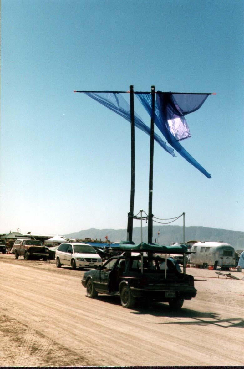 burningmanCarBlueflag